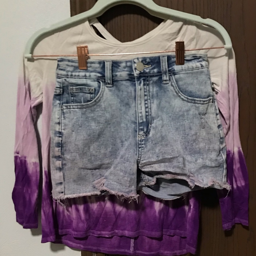 Purple and white shirt with purple shorts
